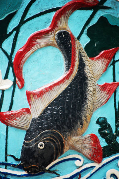 istock Art sculpture stone carving carp fish on wall 1331622756