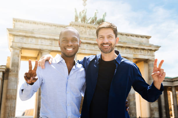 Gay Couple Making Victory Signs