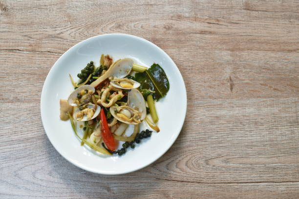 istock spicy stir fried clam with squid and pepper cople slice finger root topping chili 1331624605