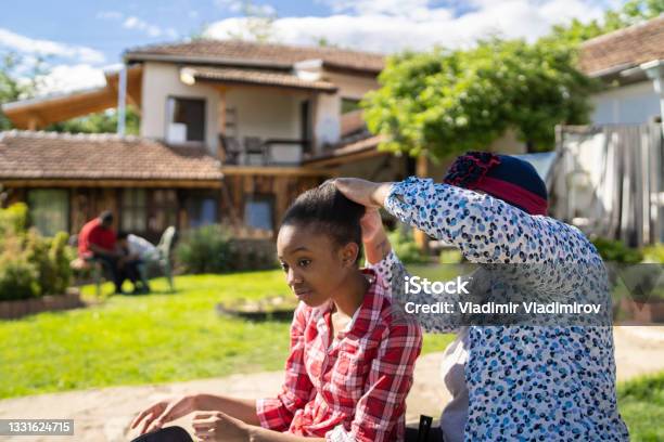 Hairstyling In The Backyard Stock Photo - Download Image Now - 12-13 Years, 30-34 Years, Adult