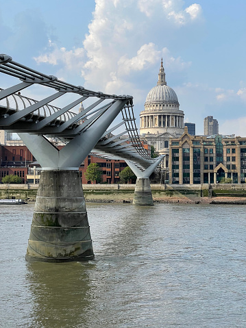 Millennium Bridge towards St. Paul's Cathedral , London, England, UK. Distinctive, well-maintained  architecture charts the history and development of the capital city with its famous London Landmarks in Summer, England, UK.