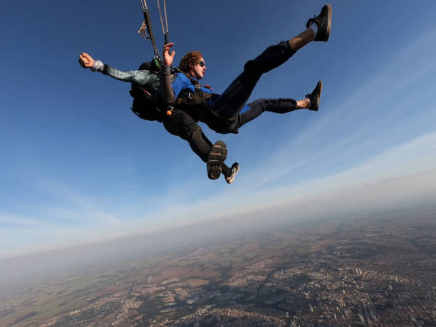 two men jump with parachute. - parachuting open parachute opening imagens e fotografias de stock