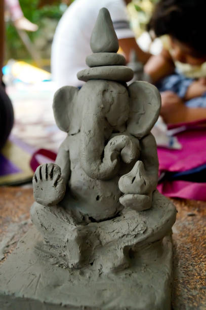 istock Pune, India, 25 August 2019. Children classes for making Ganesh/Ganpati idol. eco friendly Ganesh/Ganpati idol or murti, home made eco Friendly Ganesha Idol for Ganapati Pooja. 1331631835