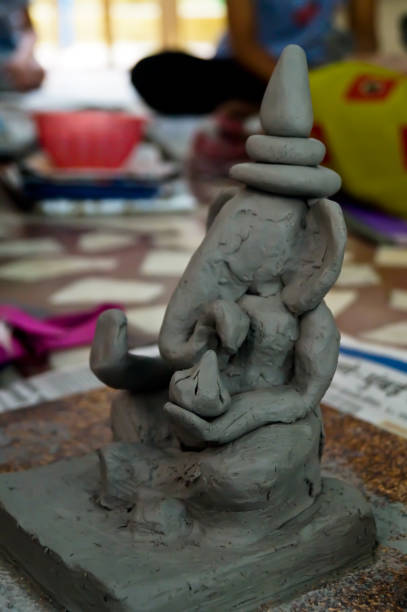 istock Pune, India, 25 August 2019. Children classes for making Ganesh/Ganpati idol. eco friendly Ganesh/Ganpati idol or murti, home made eco Friendly Ganesha Idol for Ganapati Pooja. 1331632554