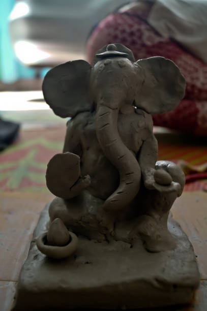 istock Pune, India, 25 August 2019. Children classes for making Ganesh/Ganpati idol. eco friendly Ganesh/Ganpati idol or murti, home made eco Friendly Ganesha Idol for Ganapati Pooja. 1331632710