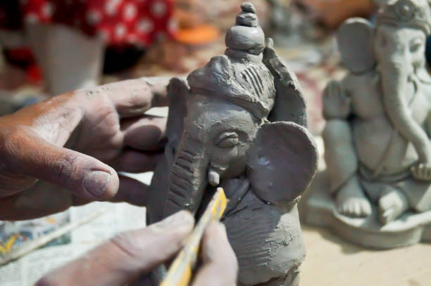 istock Pune, India, 02 September 2018. Children classes for making Ganesh/Ganpati idol. eco friendly Ganesh/Ganpati idol or murti, home made eco Friendly Ganesha Idol for Ganapati Pooja. 1331633454