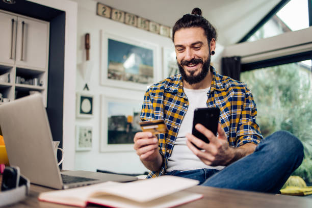 istock Young man taking a break while working and shopping online 1331634181