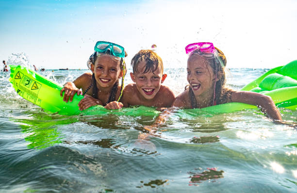 istock Children enjoying splashing water 1331634614