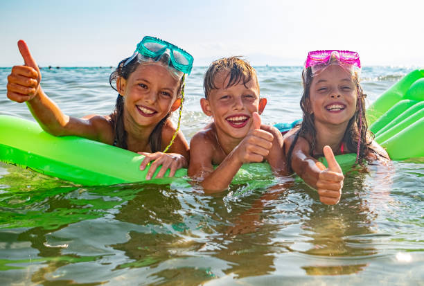 istock Happy kids at the sea 1331635290