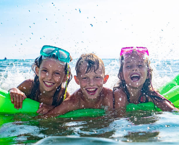 istock Kids happy at the sea 1331635305