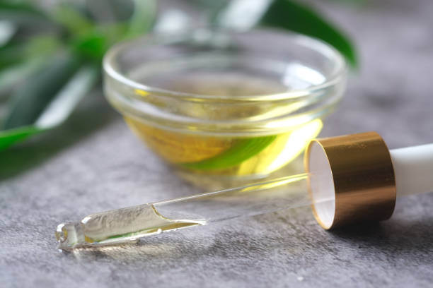 istock pipette and oil in a small container on table 1331635399