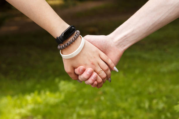 istock man and woman hold hands. hands closeup 1331635429