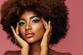 istock Portrait of young afro woman with bright make-up 1331637318