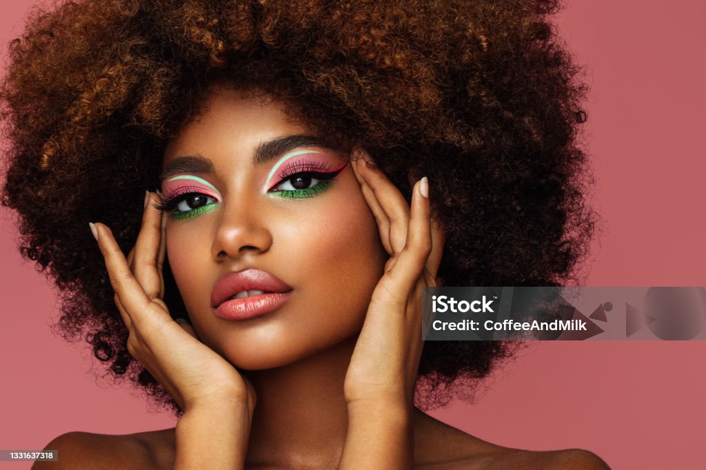 Portrait of young afro woman with bright make-up Make-Up Stock Photo