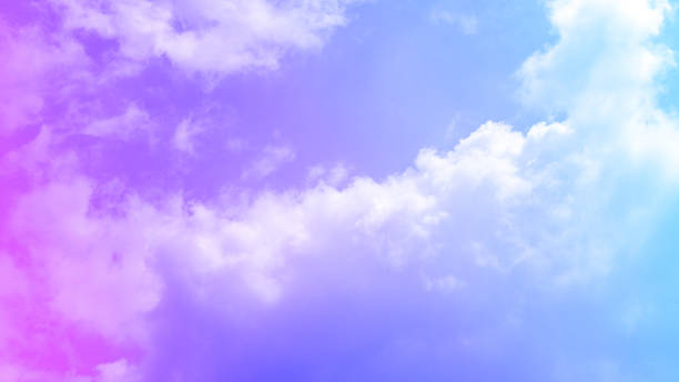 istock beauty abstract sweet pastel soft yellow with fluffy clouds on sky. multi color rainbow image. fantasy growing light 1331639421