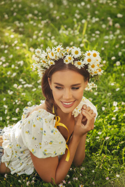 istock Beautiful woman lying on the grass 1331640158