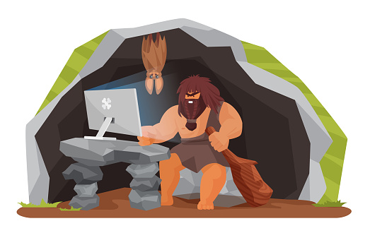 Ancient caveman using computer in prehistoric cave, stone age wild man sitting with pc