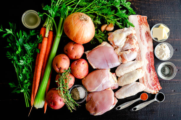 istock White Wine Chicken Stew Ingredients on a Dark Wood Background 1331652097
