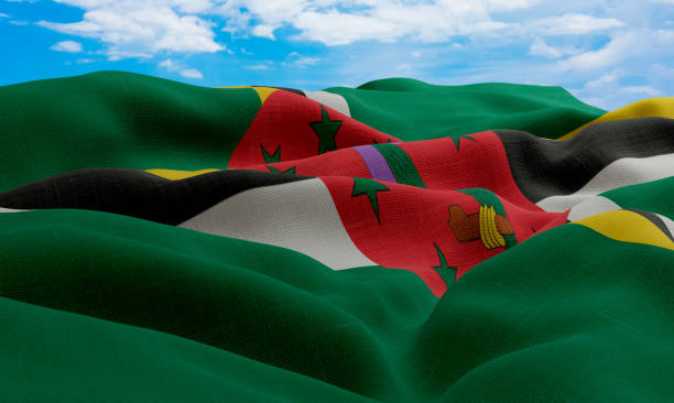 istock Dominica flag in the wind. Realistic and wavy fabric flag. 3D rendering. 1331662414