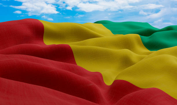 istock Guinea flag in the wind. Realistic and wavy fabric flag. 3D rendering. 1331662543