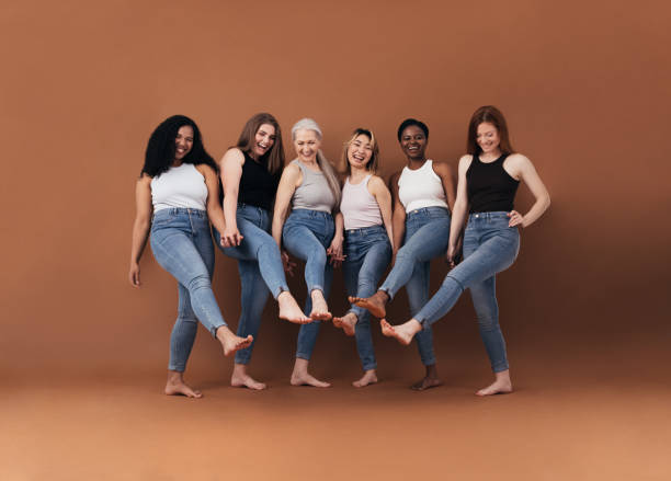 istock Six multi-ethnic women having fun together against brown background 1331669566