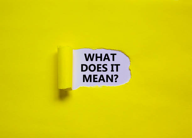 istock What does it mean symbol. Concept words 'what does it mean' appearing behind torn yellow paper. Beautiful yellow background. Business and support concept. Copy space. 1331672348