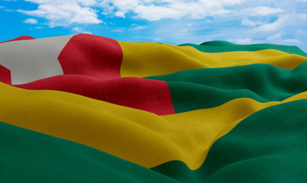 istock Togo flag in the wind. Realistic and wavy fabric flag. 3D rendering. 1331673349