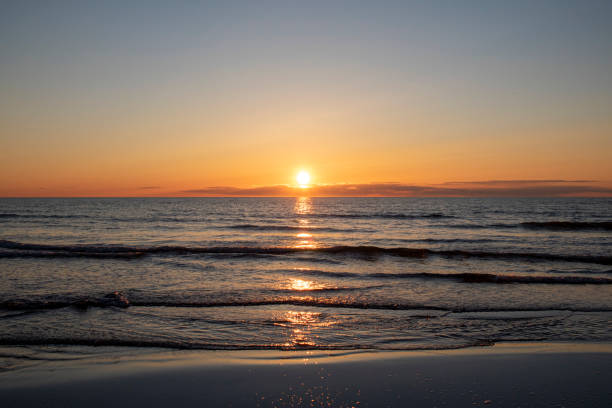 istock Evening at the beach - watching the sun fall 1331673592