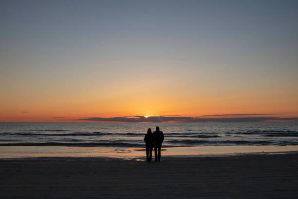 istock Evening at the beach - watching the sun fall 1331673604
