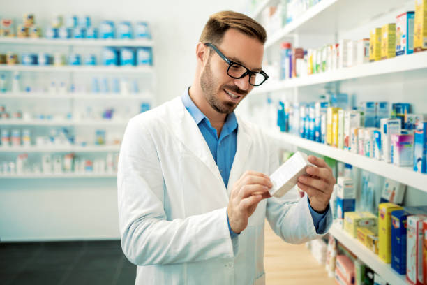 istock Pharmacist with eyeglasses checking inventory at pharmacy 1331674262