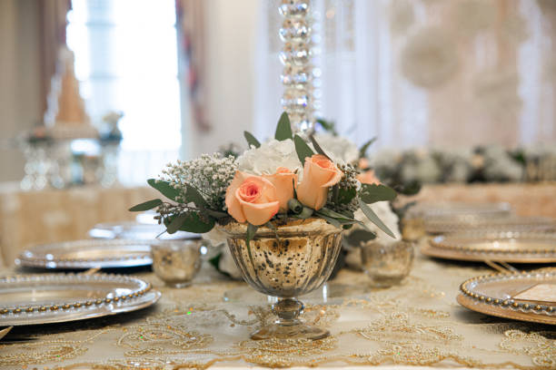istock Gold table centerpieces with white ball flowers with diamonds 1331677359