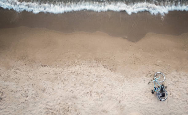 Top view of bicycle on the beach