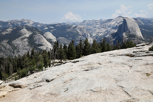 Yosemite NP, CA, USA - March 29, 2022:  Majestic views of granite formations, waterfalls, lakes and streams located within this popular destination.