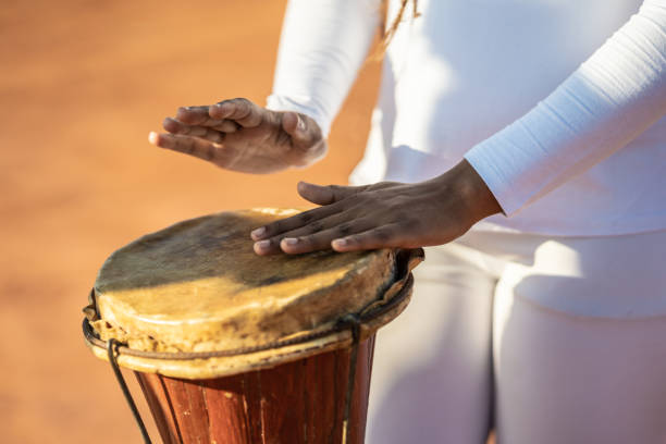 istock Capoeira woman playing percussion instrument 1331690617