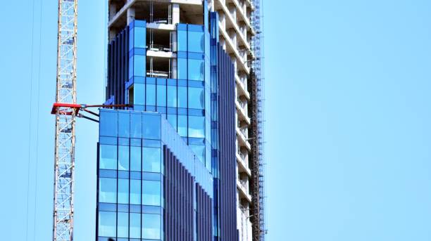 istock Eco architecture. Green tree and glass office building. 1331691705