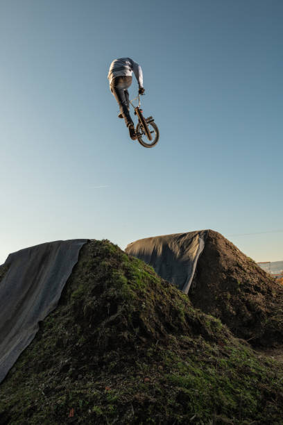 istock BMX Bike jump over a dirt trail 1331697049