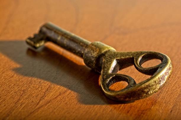 istock Close-up antique desk key on wooden table 1331702874