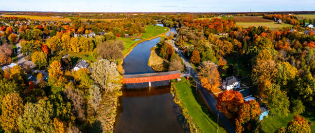 Aerial West Montrose Covered Bridge  and Grand River near Kitchener, West Montrose, Canada - Kissing Bridge Kitchener, Waterloo Regional, Canada. kitchener ontario photos stock pictures, royalty-free photos & images