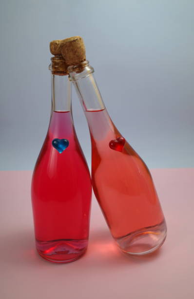 istock beautiful multi-colored bottles with hearts representing loving couples. Abstraction on the theme of lgbt couples, heterosexual couples. Romantic background. 1331709881