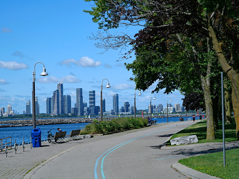 Toronto, Canada - July 30, 2021: Waterfront Trail biking and running path beside Lake Ontario in Toronto