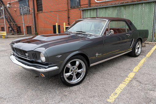 Elizabethtown, KY, USA - July 31, 2021: Black classic Ford Mustang on display during the Cruisin' The Heartland 2021 car show in downtown Elizabethtown, KY.