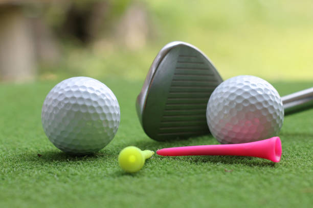 istock Golf ball on green grass in the evening golf course with sunshine 1331716396