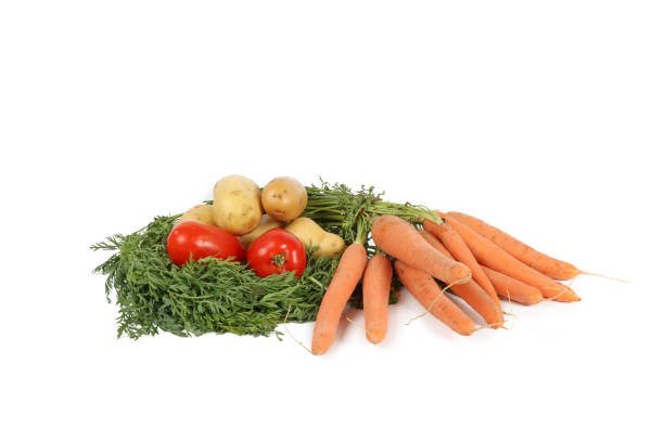 tomatoes potatoes and carrots isolated on white