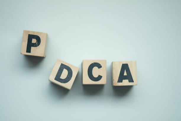 istock Alphabet letter block in word PDCA (business abbreviation of plan do check act). Top view 1331733502