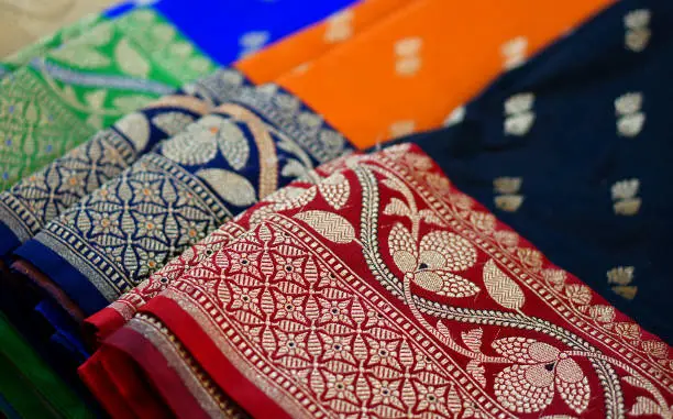 Photo of view of Indian woman fashion and tradtional wear sarees in shop display