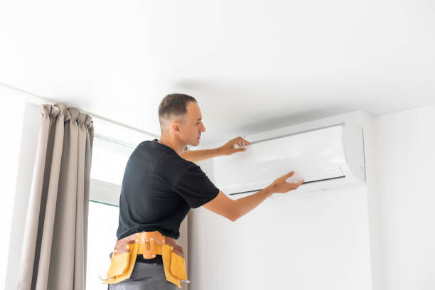 istock Rear View Of A Man Cleaning Air Conditioning System 1331734668