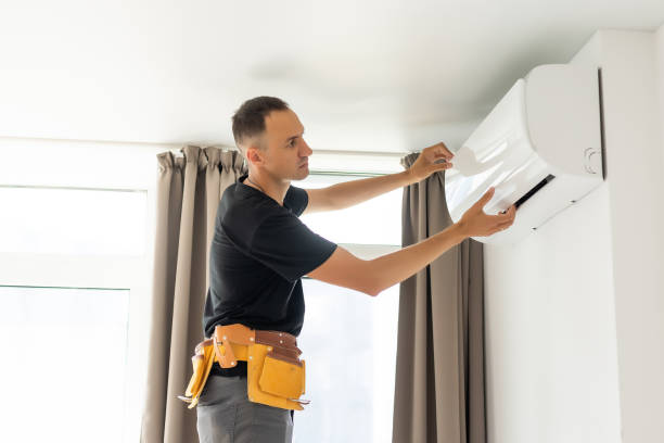 istock Rear View Of A Man Cleaning Air Conditioning System 1331734864