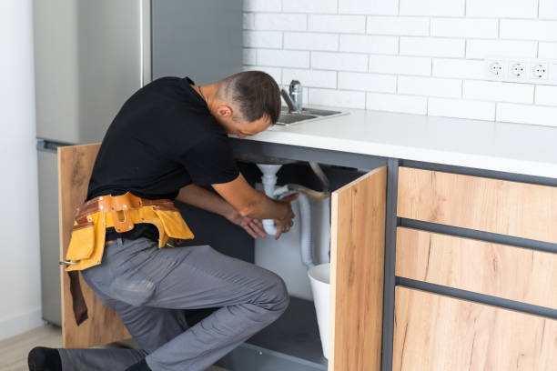 istock Man installing the kitchen tap and the sink 1331735638