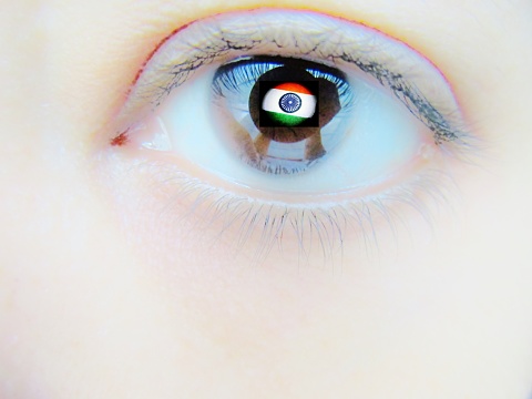An eye with Indian flag reflection.