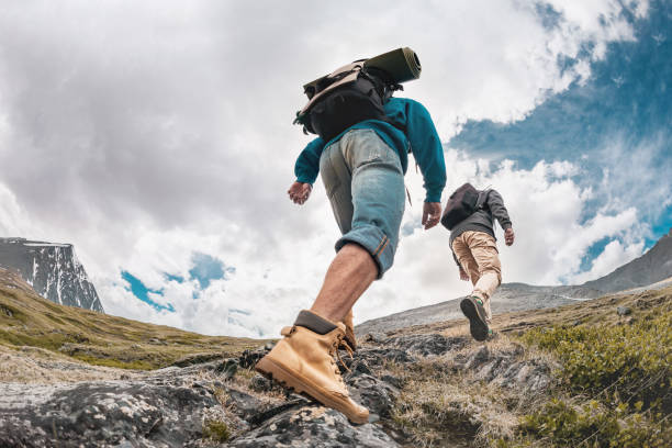 istock Two hikers tourists are walking in mountains 1331736797